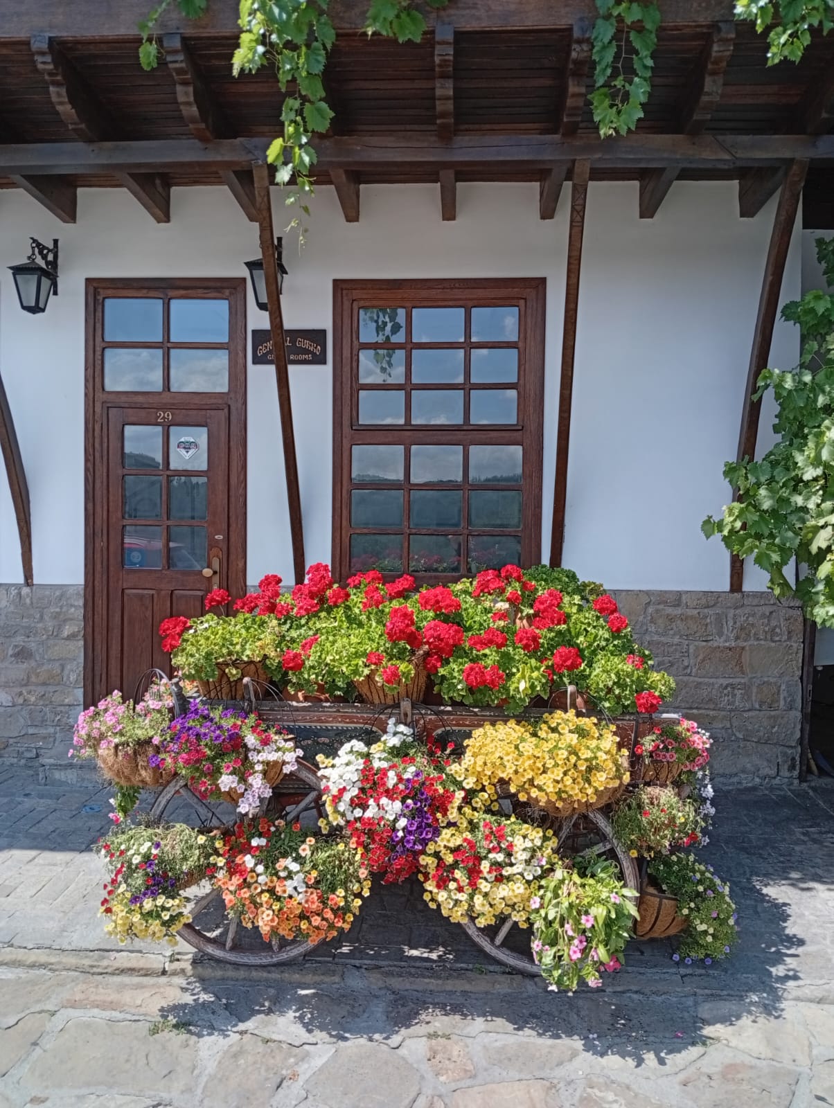 Colors of Bulgaria – Blooming Wagon, Veliko Tarnovo | Cross-Stitch Pattern | Floral Rustic Wagon Embroidery Design (226 x 300 Stitches) | DMC and ANCHOR conversion included